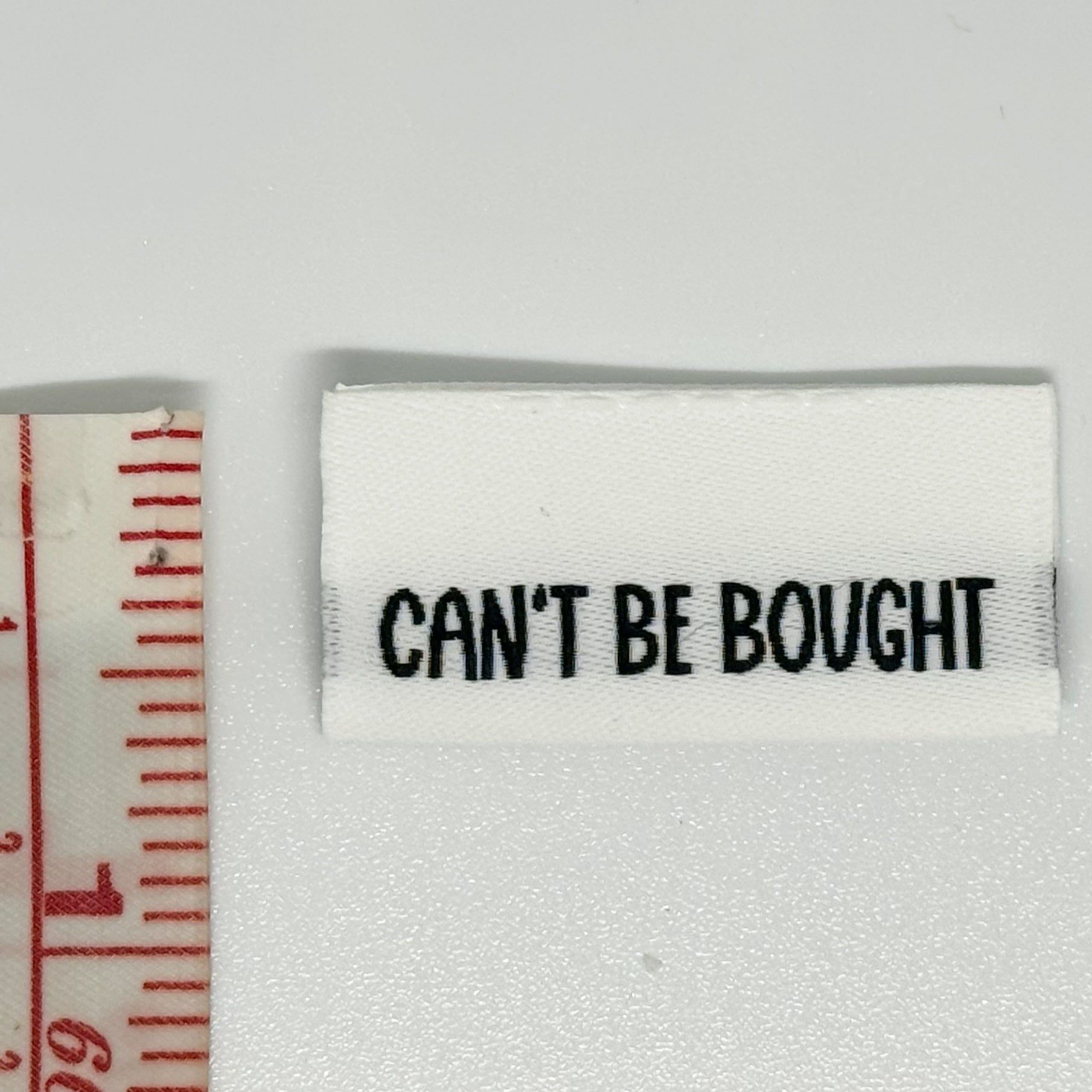 Can’t Be Bought Woven Label image 1