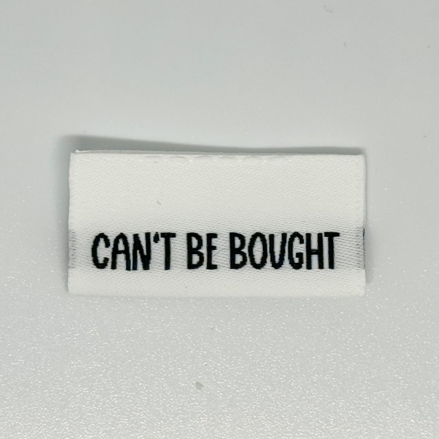 Can’t Be Bought Woven Label image 0