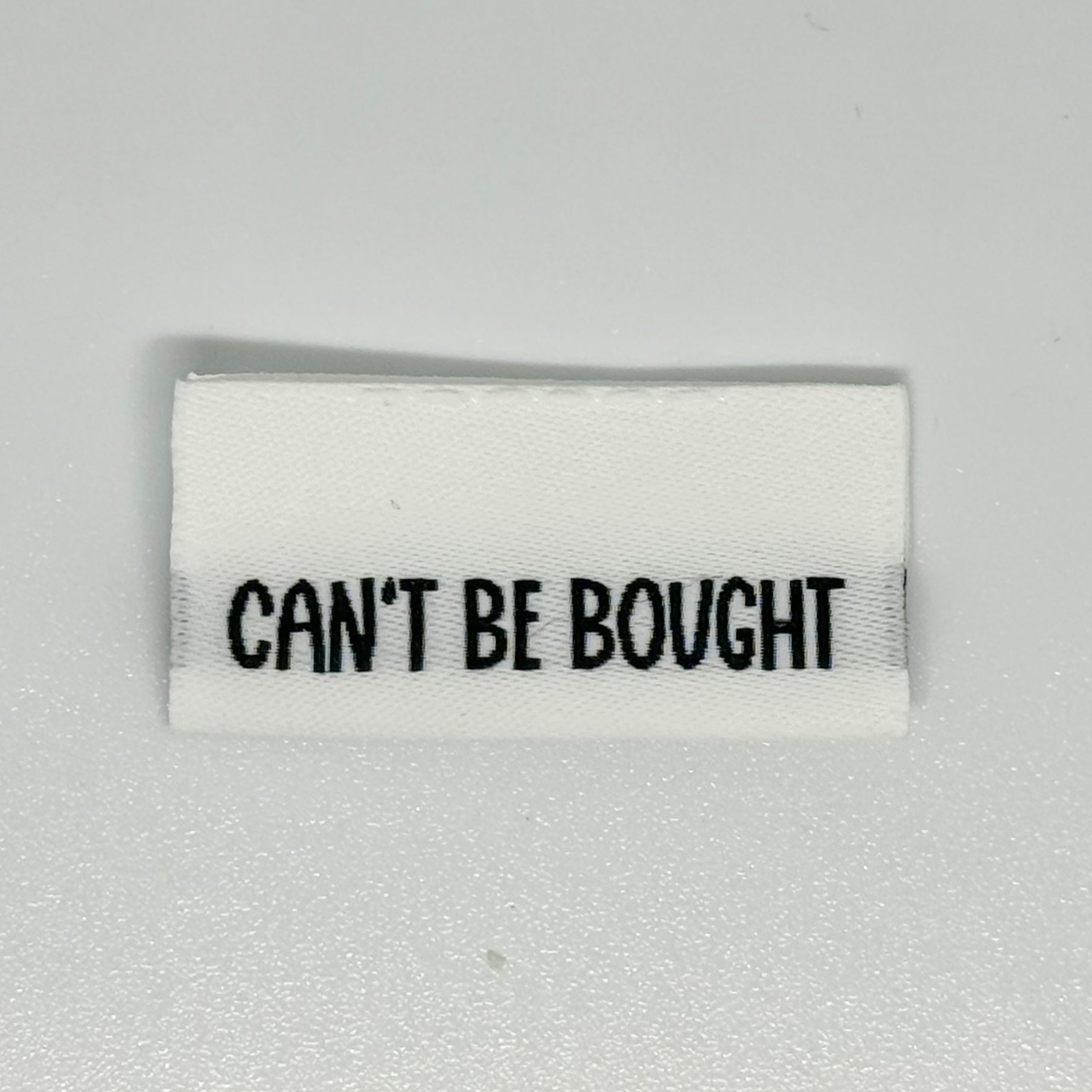 Can’t Be Bought Woven Label image 0